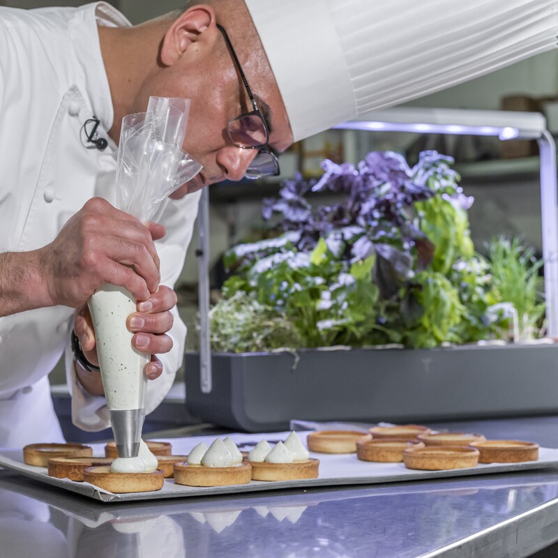 Chef Guzman preparing his lemon basil tarts